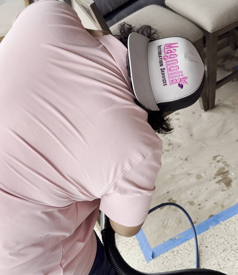 Technician cleaning an upholstered chair